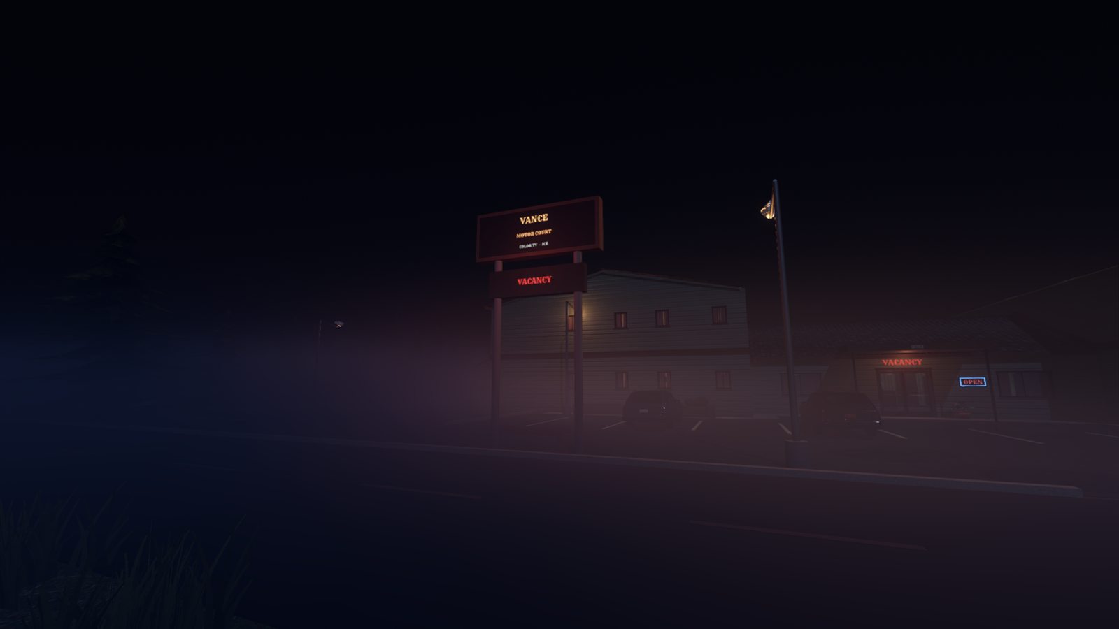 The Vance Motor Court sign glowing VACANCY in the fog at night